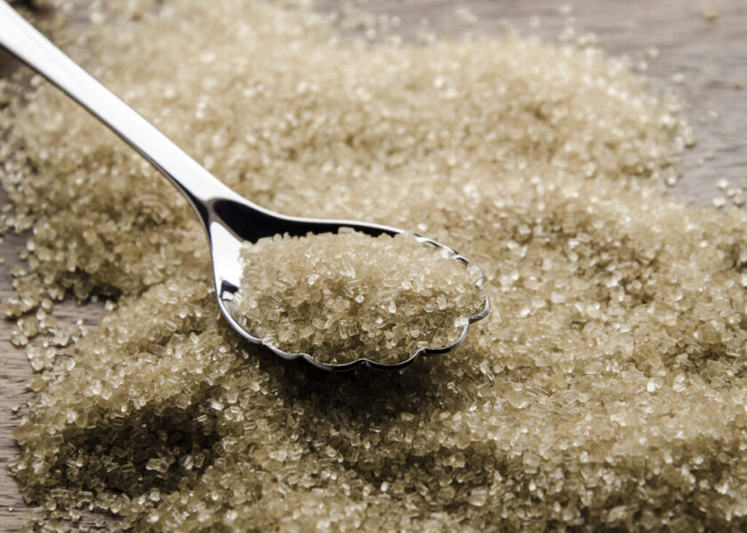 brown cane sugar with silver spoon